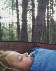 child sleeping in a tent