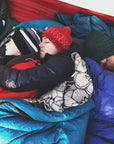 snuggled sleeping in tent