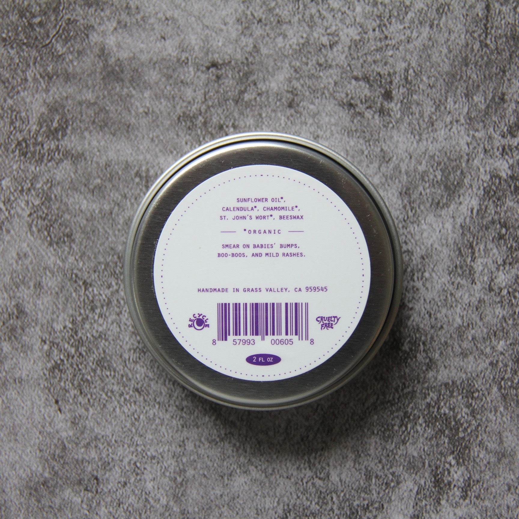 Back label of Babies Moon Salve on gray background 