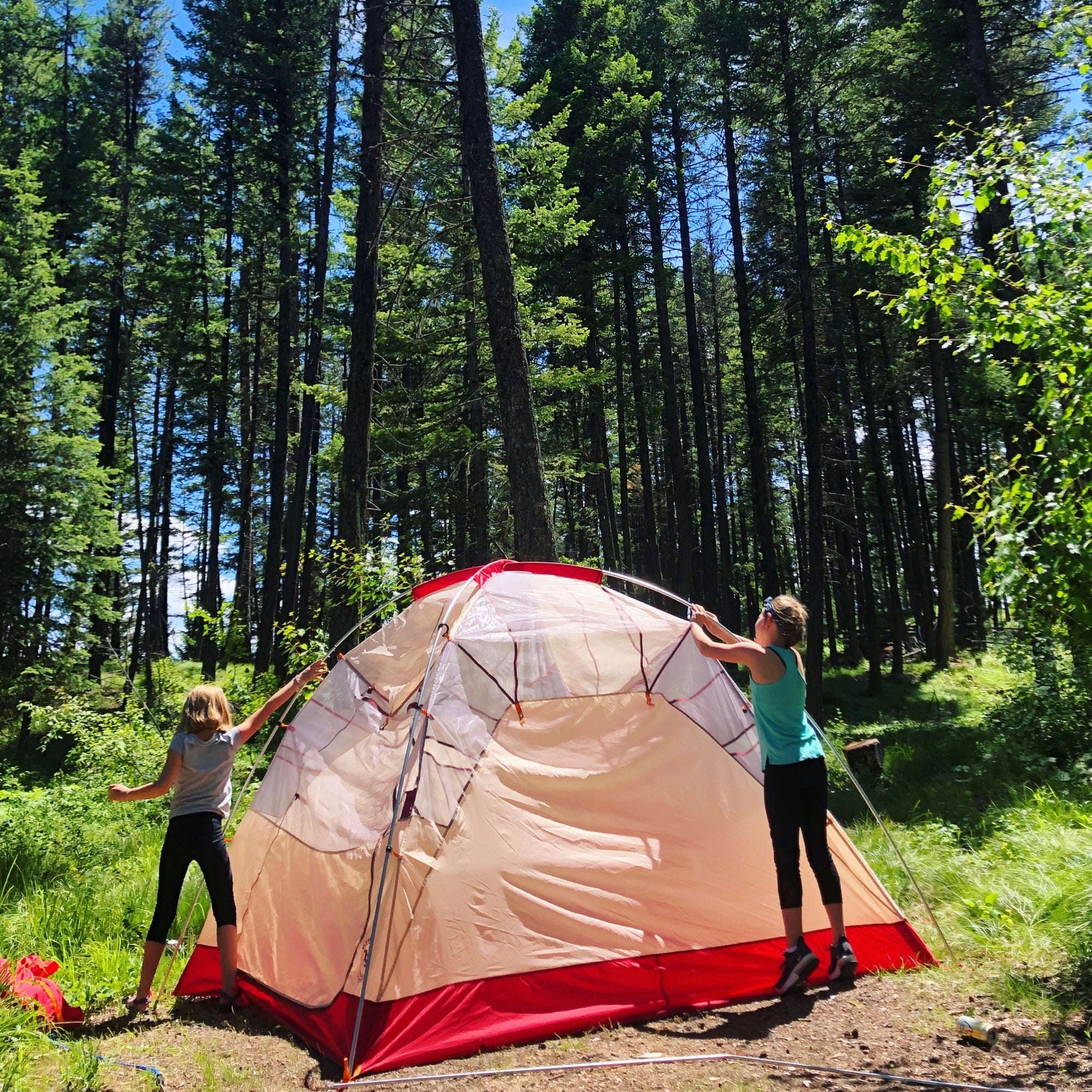 children setting up tent