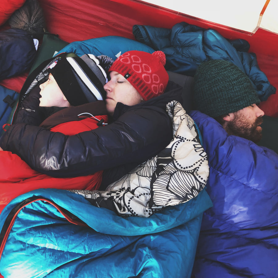 snuggled sleeping in tent