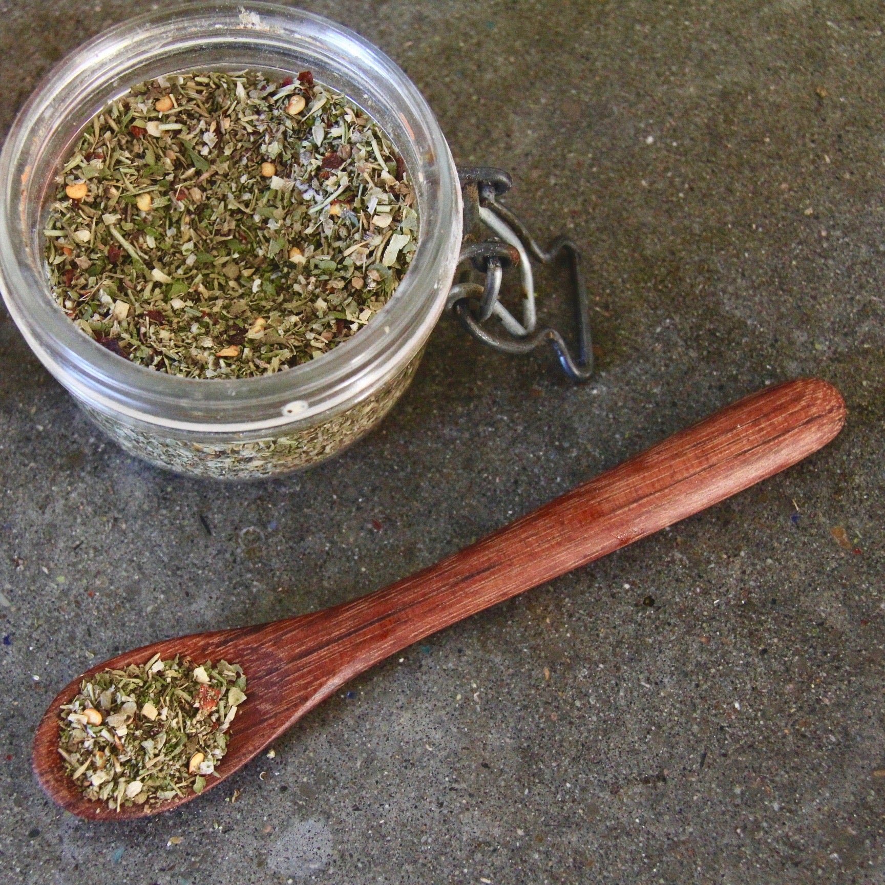 Camp Director's Handcrafted Herb + Spice Blend and small wooden spoon