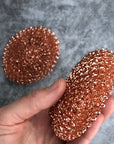 Two copper pot scrubbers. 